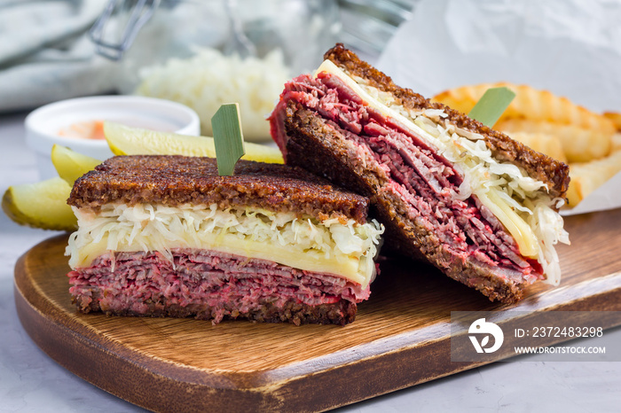 Classic reuben sandwich, served with dill pickle, potato chips, horizontal