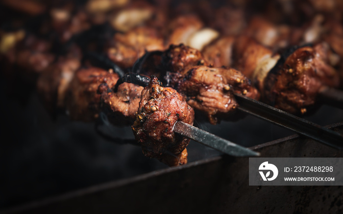 Grilling shashlik on barbecue grill