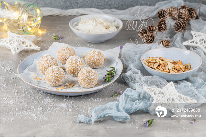 Homemade sweet white chocolate and coconut in a plate. Raffaello candy - snowball truffles on a Chri