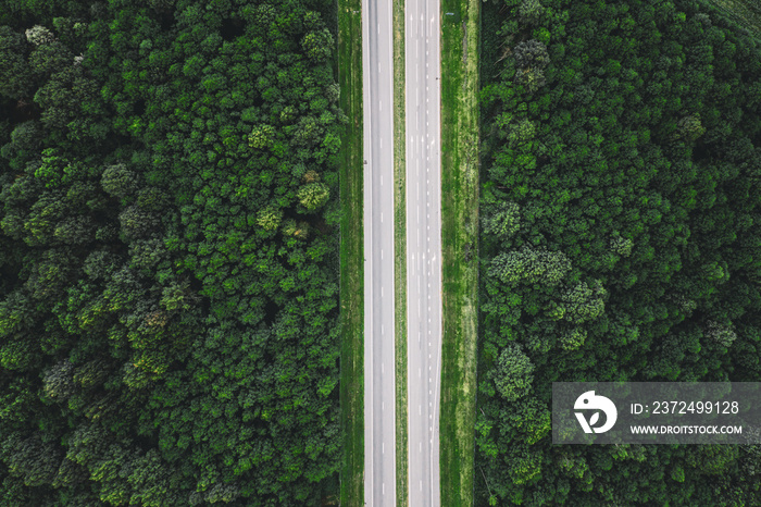 Aerial View Of Highway Road Through Green Forest Landscape In Summer. Top View Flat View Of Highway 