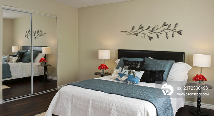 Elegant bedroom with decorated wall; California; United States of America