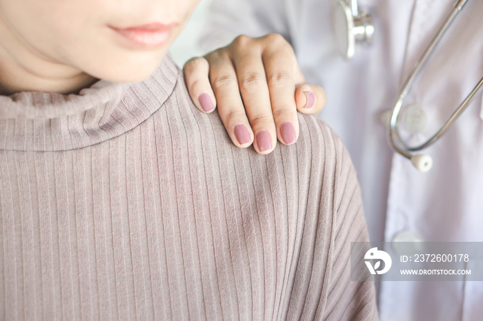 doctor hand on shoulder of  stress female patient comforting and talking about examination at hospit