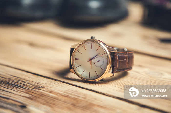 watch with shoes on table