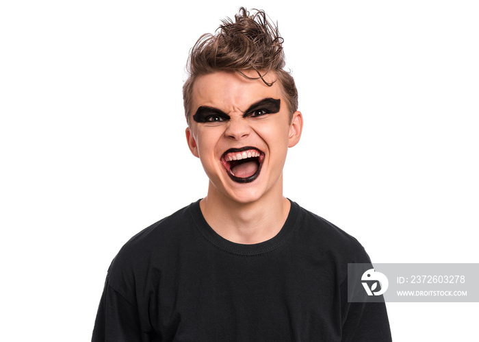 Rebellious teen boy dressed in black, isolated on white background. Angry screaming teenager in styl