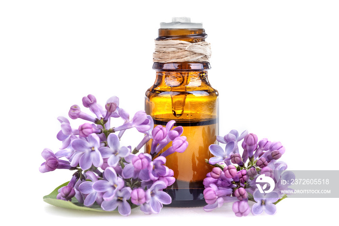 Essential oil made from lilac on a white background