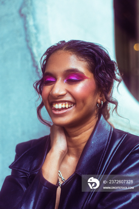 portrait of person in concrete environment, laughing