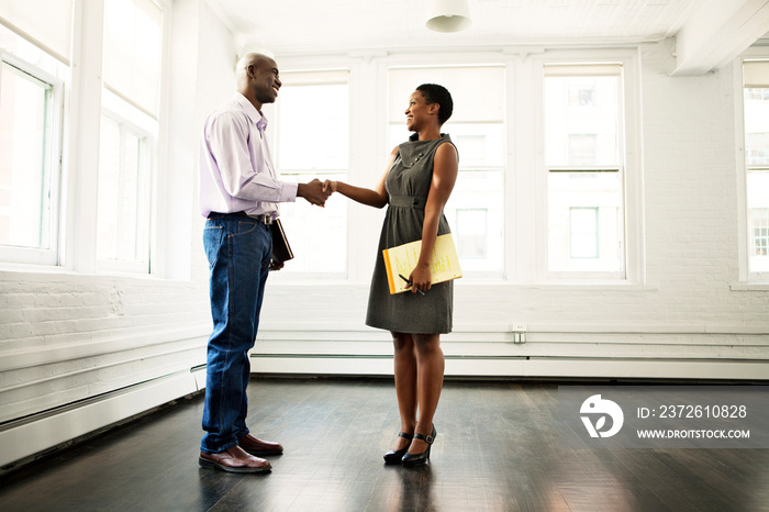 Man shaking hands with real estate agent