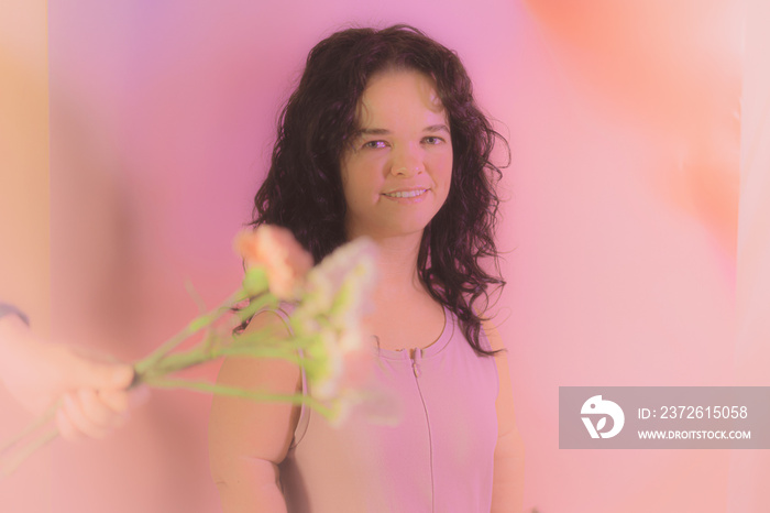 Woman posing with flowers