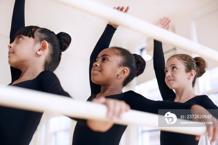 Child ballet dancers practicing in studio