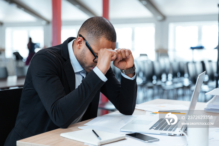 Exhausted businessman at his desk