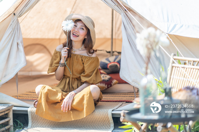 Beautiful Asian women backpacking for camping during summer holidays.