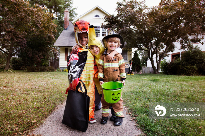 Portrait of smiling children in costumes during Halloween