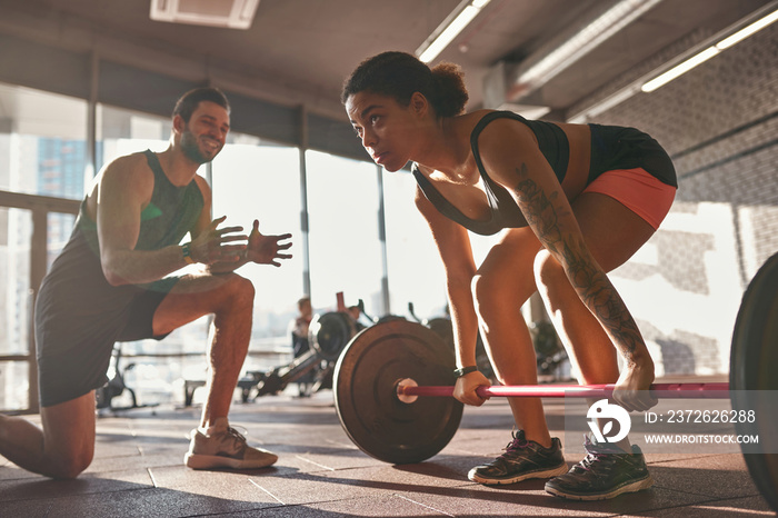 Trainer tell at black girl do deadlift in gym