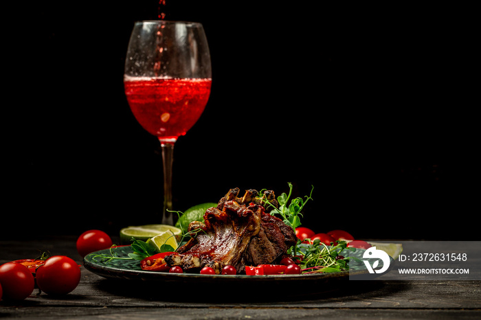 grilled ribs with a in sour sweet berry sauce served with green seedlings served over big plate with