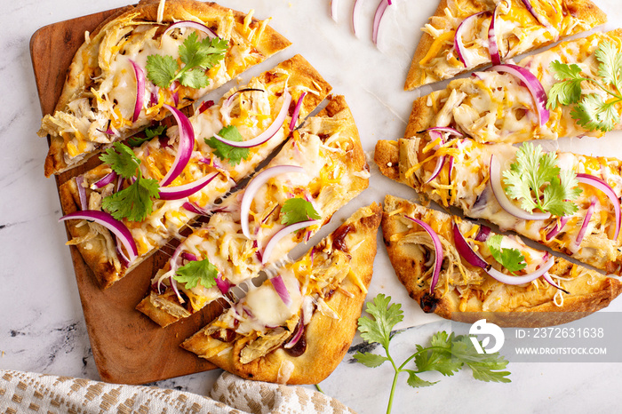 Barbecue chicken flatbreads with hot sauce and red onion