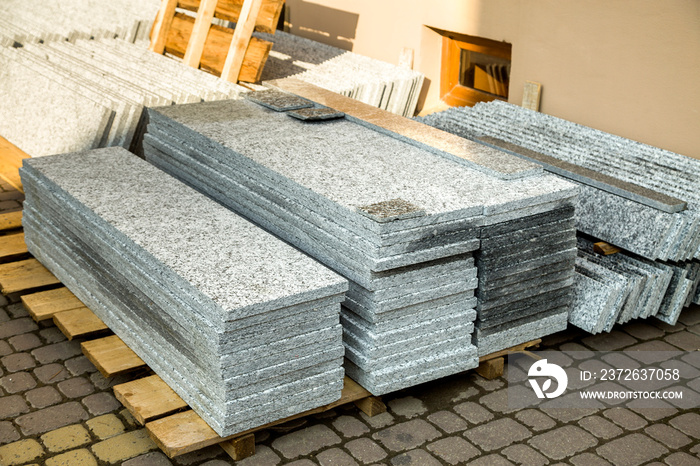 Piles of granite marble slabs.  Stone sheets for decorative construction.