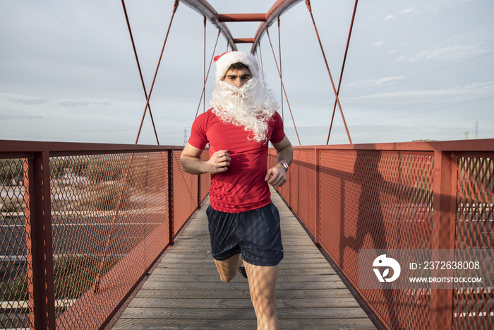 Santa Claus running on bridge for burn fat after christmas holidays