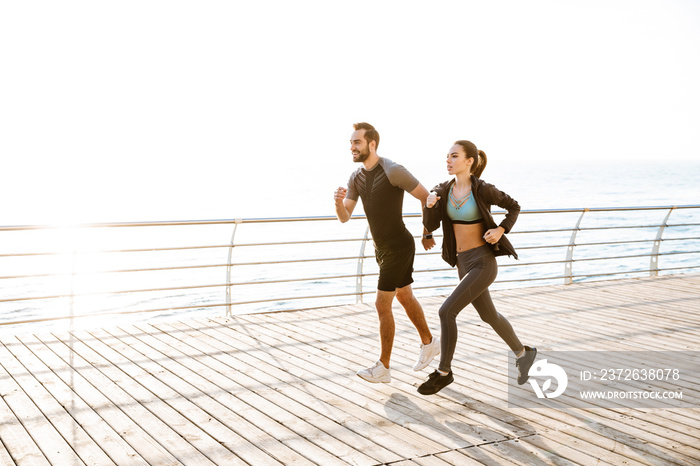 Attractive sporty young fitness couple