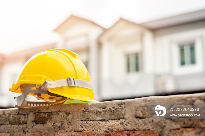 Yellow helmet on house background