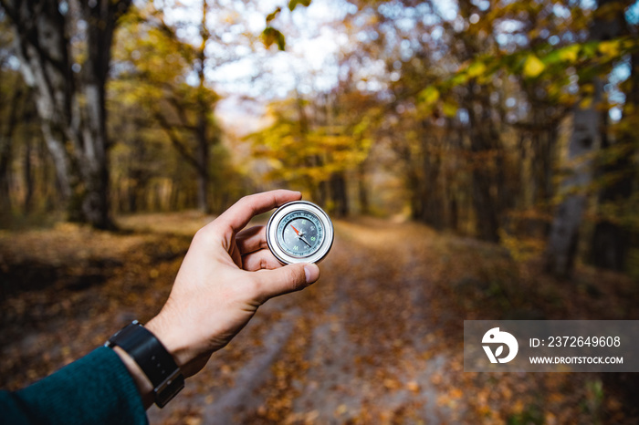 man hand compass