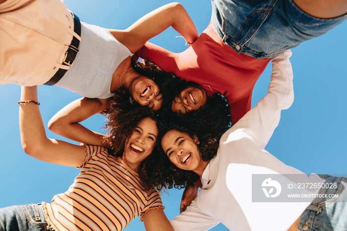 Low angle view of four smiling women