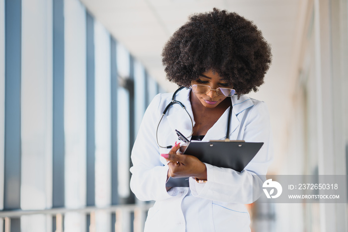 portrait of african female doctor at workplace