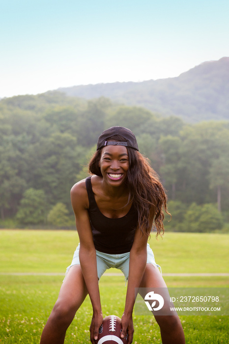 Portrait of young woman wearing baseball cap