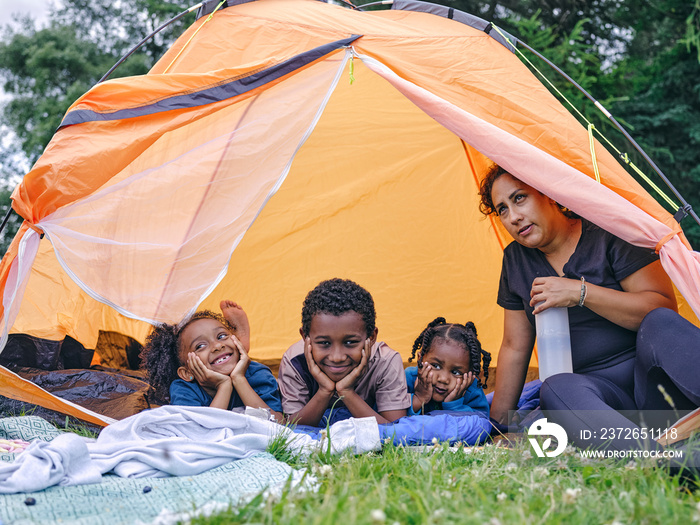 Mother and children in tent