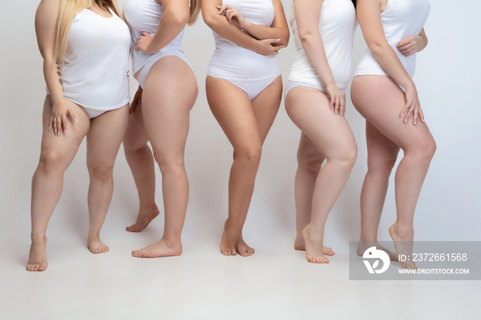 In love and harmony with myself. Close up of plus size young women posing on white background. Femal