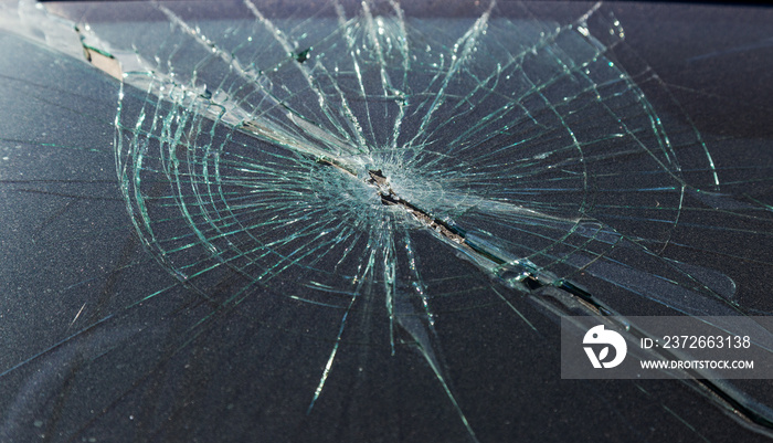 Terrible dangerous car after a fatal accident. Broken windshield. A broken car with broken glass. Сa