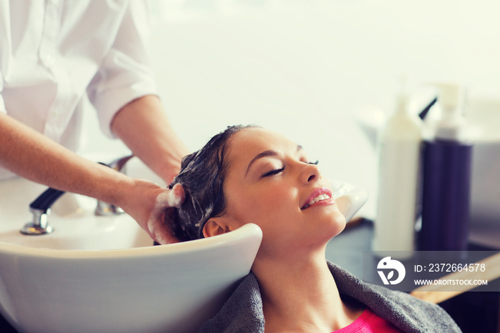 happy young woman at hair salon