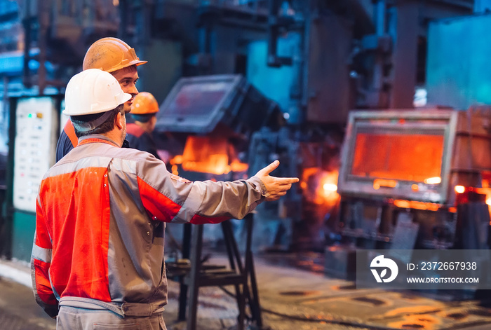 Workers in the steel mill.