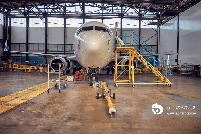 Passenger aircraft on service in an aviation hangar