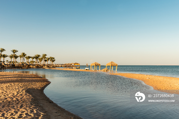 Beautiful  beach with palm trees at sunset, Sharm El Sheikh,  Red sea, Egypt