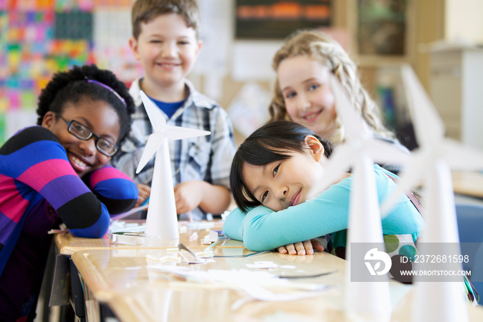 Elementary students displaying wind turbine models