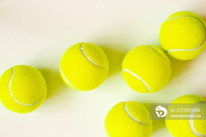 Close-up tennis balls on white background with copy space, top view. Active lifestyle concept. Sport