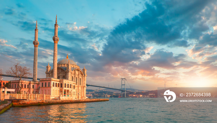 Ortakoy mosque and Bosphorus bridge at amazing sunset - Istanbul, Turkey