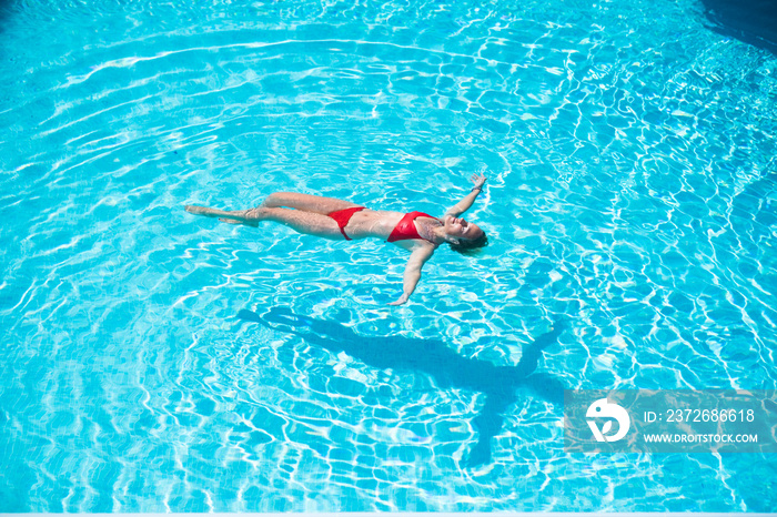 Young caucasian woman relax and enjoy summer holiday vacation floating laying on the water at the po