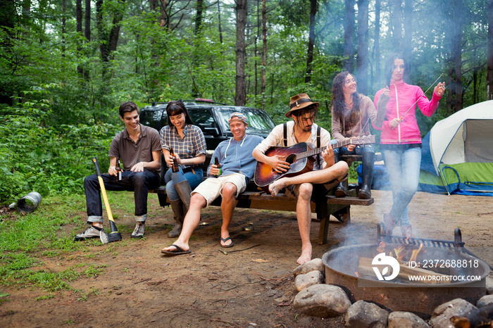 Friends relaxing at campsite