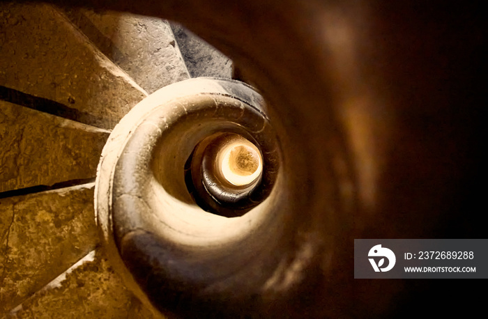 Closeup shot of spiraling stone stairs
