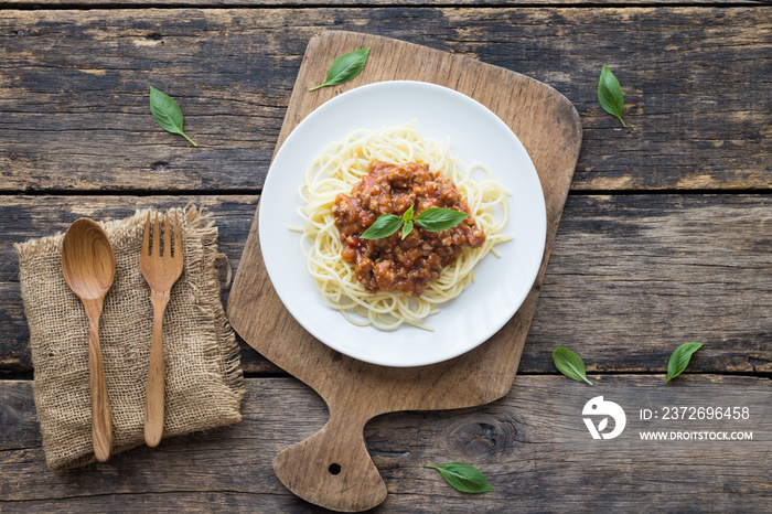 Spaghetti Bolognese on wooden background. top view