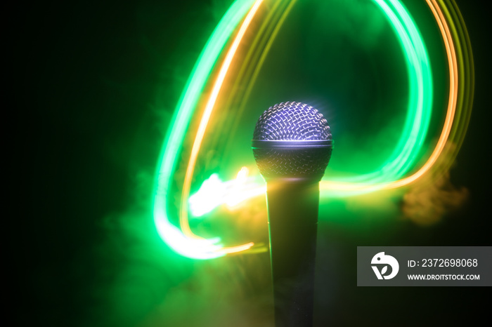 Microphone karaoke, concert . Vocal audio mic in low light with blurred background. Live music, audi