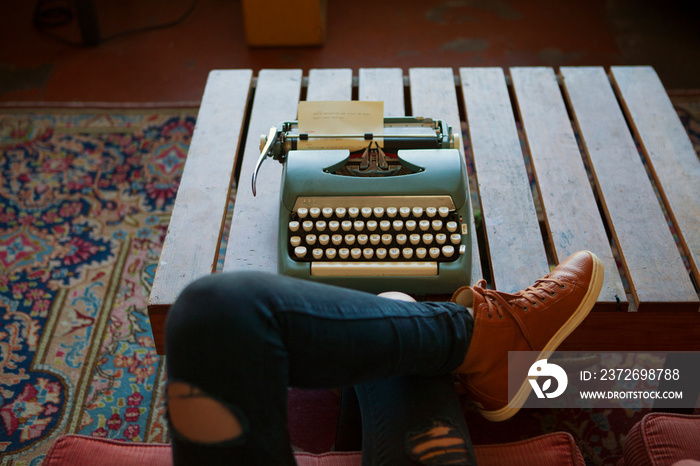 Young woman with typemachine,  low section