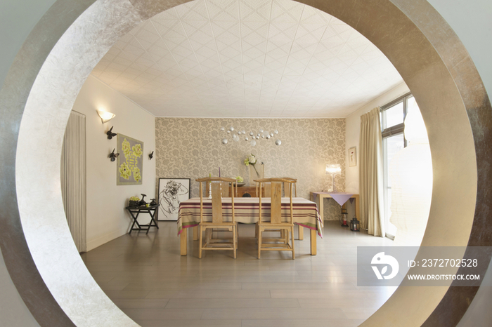 View of spacious dinning room through circular wall