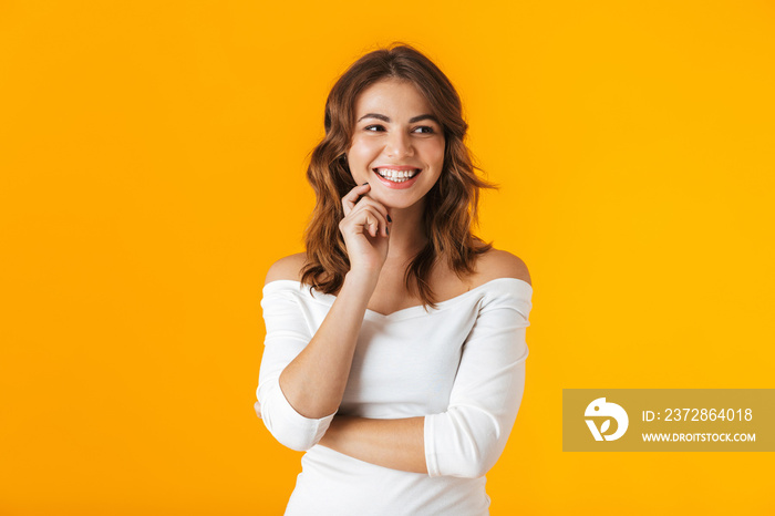 Portrait of a cheerful young woman wearing white shirt