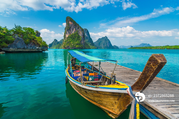 Beautiful nature scenic landscape Phang-Nga bay with wooden boat moored on pier waiting traveler, Wa