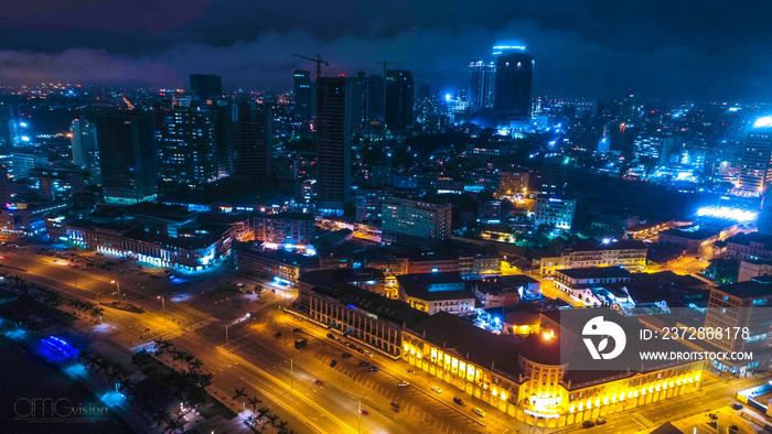 Road, lights and sea at night. Luanda city captured from the top