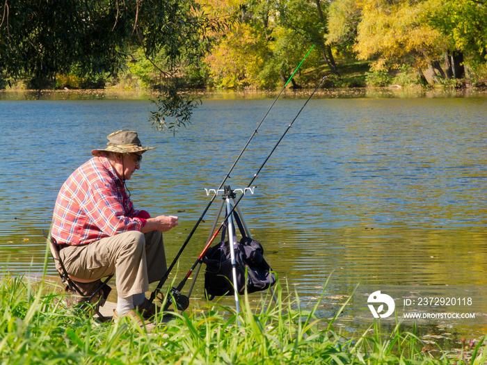 Senior fisherman catches a fish