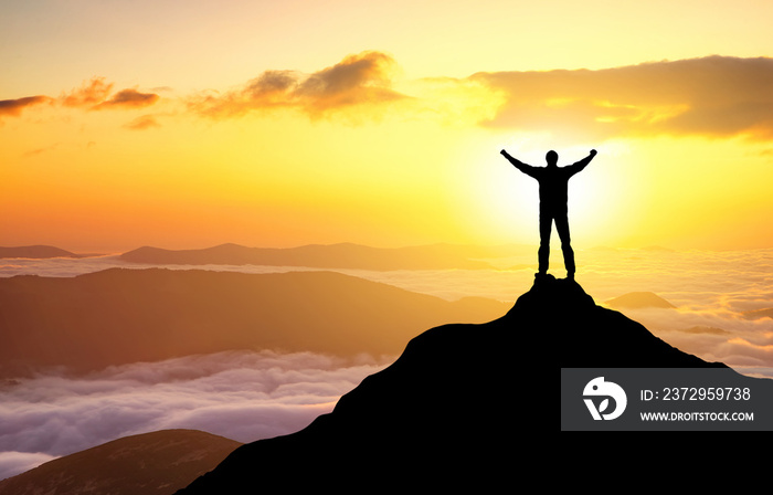 Silhouette of a champion on mountain top