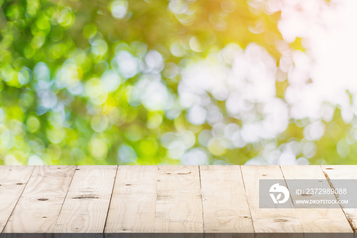 green bokeh in garden and table with space